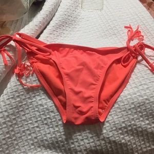 Orange bikini bottom with tassels